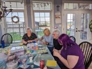 Sheila, Angelika, Ann and Megan Concentrating Hard Making Bracelets 